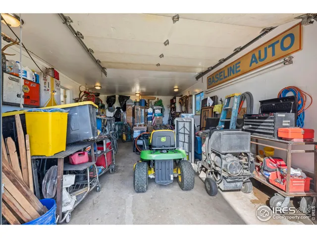a view of a house with backyard sitting area and garden