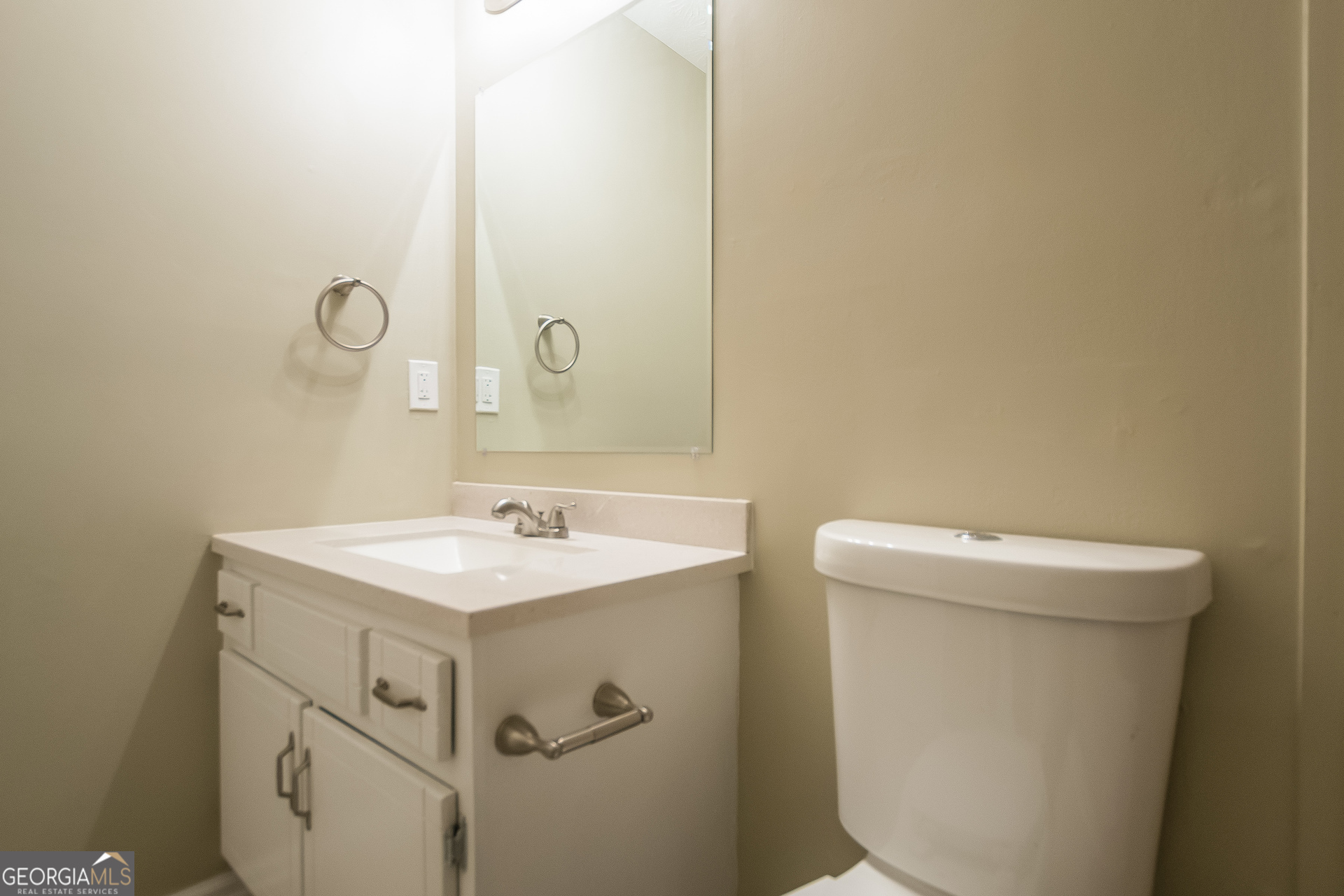 302 West Paulding Boulevard Dallas, GA 30157 - Photo 13 of 15 a bathroom with a sink a toilet and a mirror