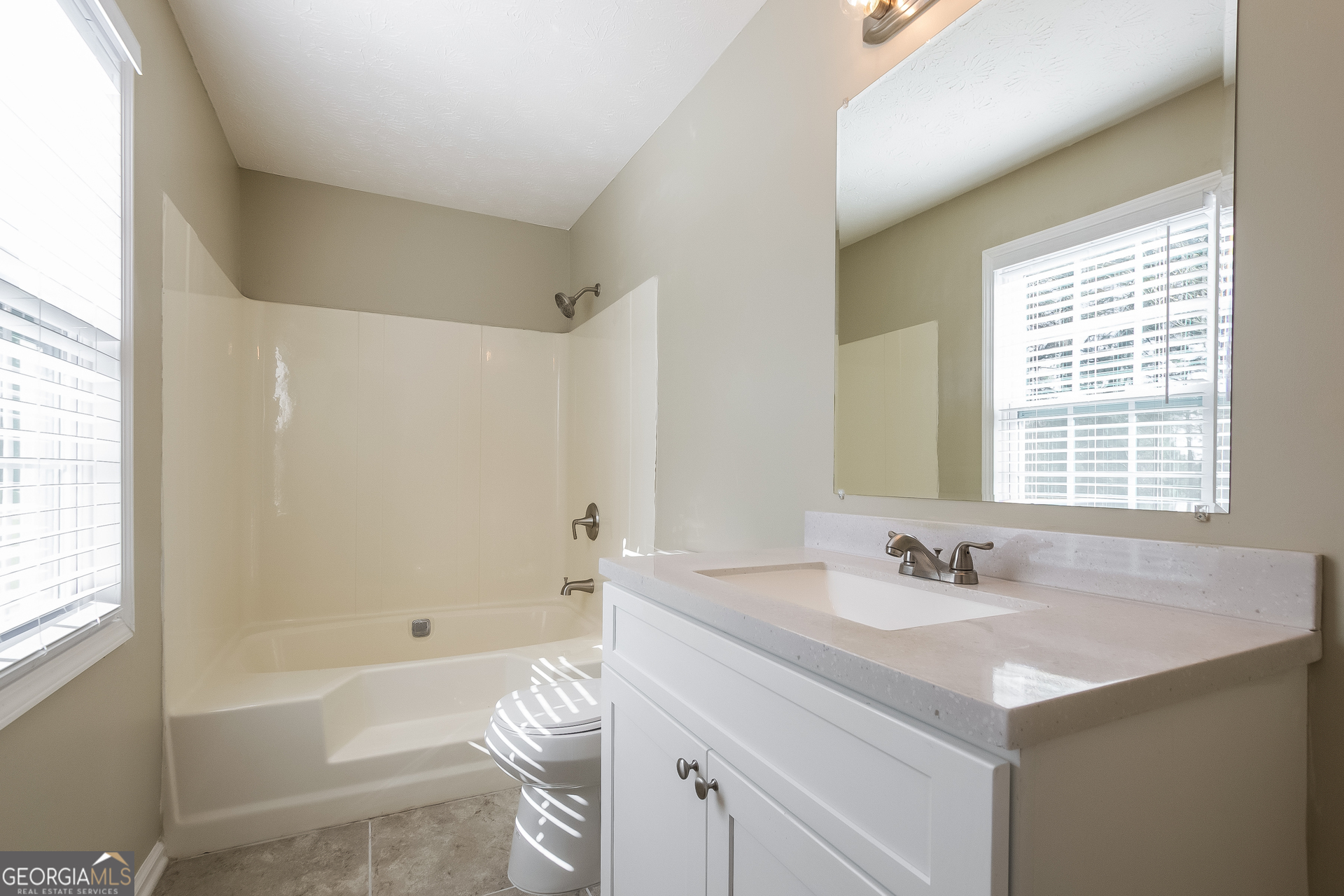 302 West Paulding Boulevard Dallas, GA 30157 - Photo 10 of 15 a bathroom with a sink and a bathtub