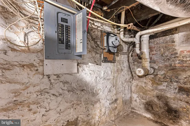 a view of a house with wooden fence