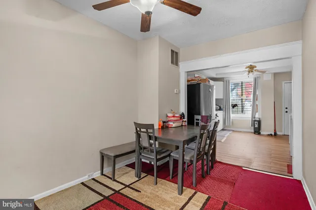 a view of a livingroom with furniture and chandelier