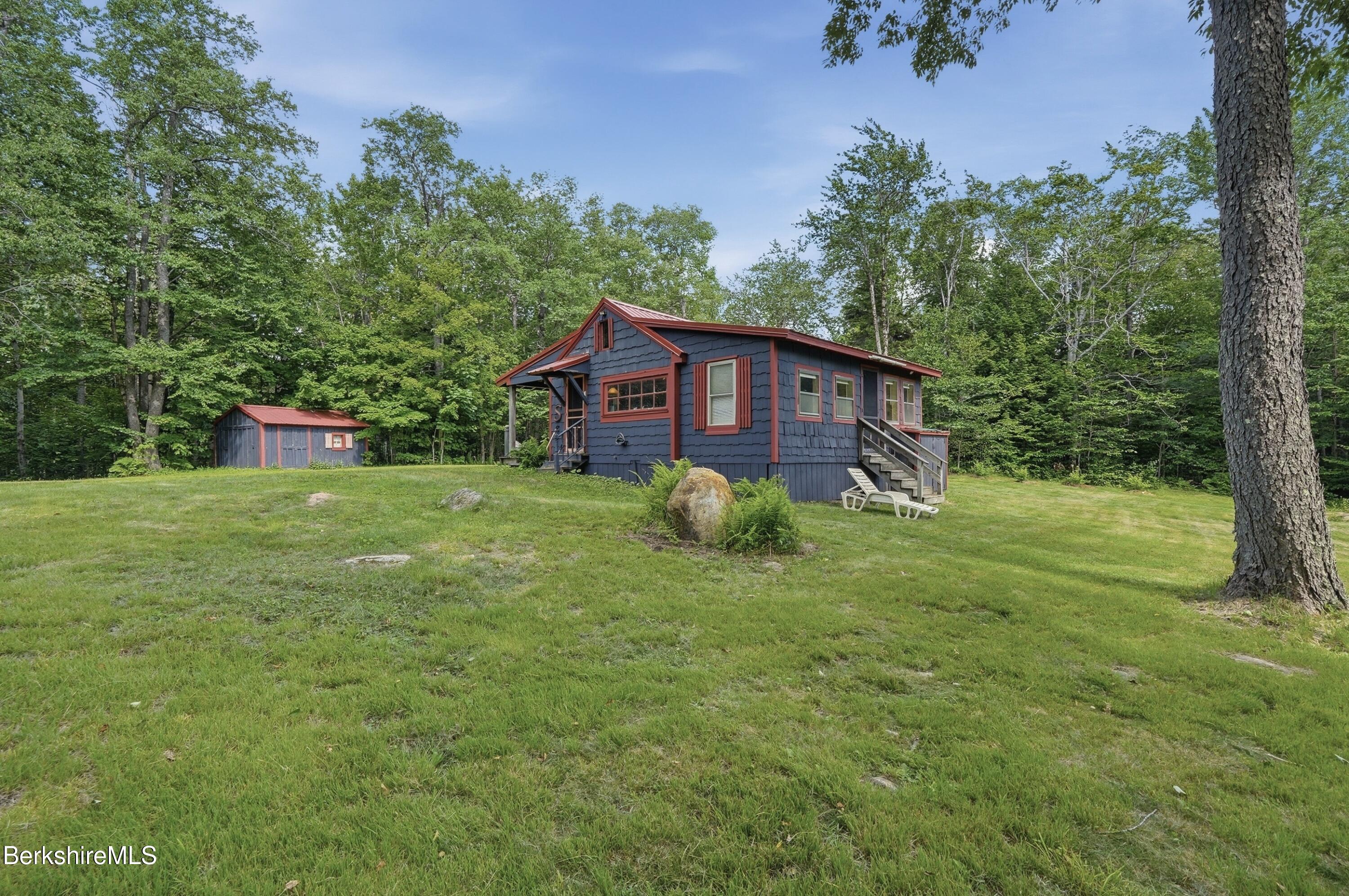 68 Curtin Road Peru, MA 01235 - Photo 6 of 38 a view of a house with a backyard