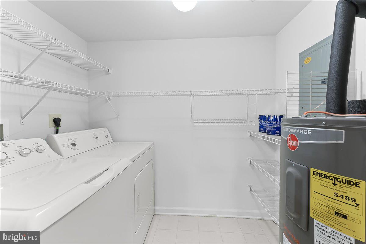 615 Brandon Road Norristown, PA 19403 - Photo 6 of 36 Laundry room, shelving, hot water tank