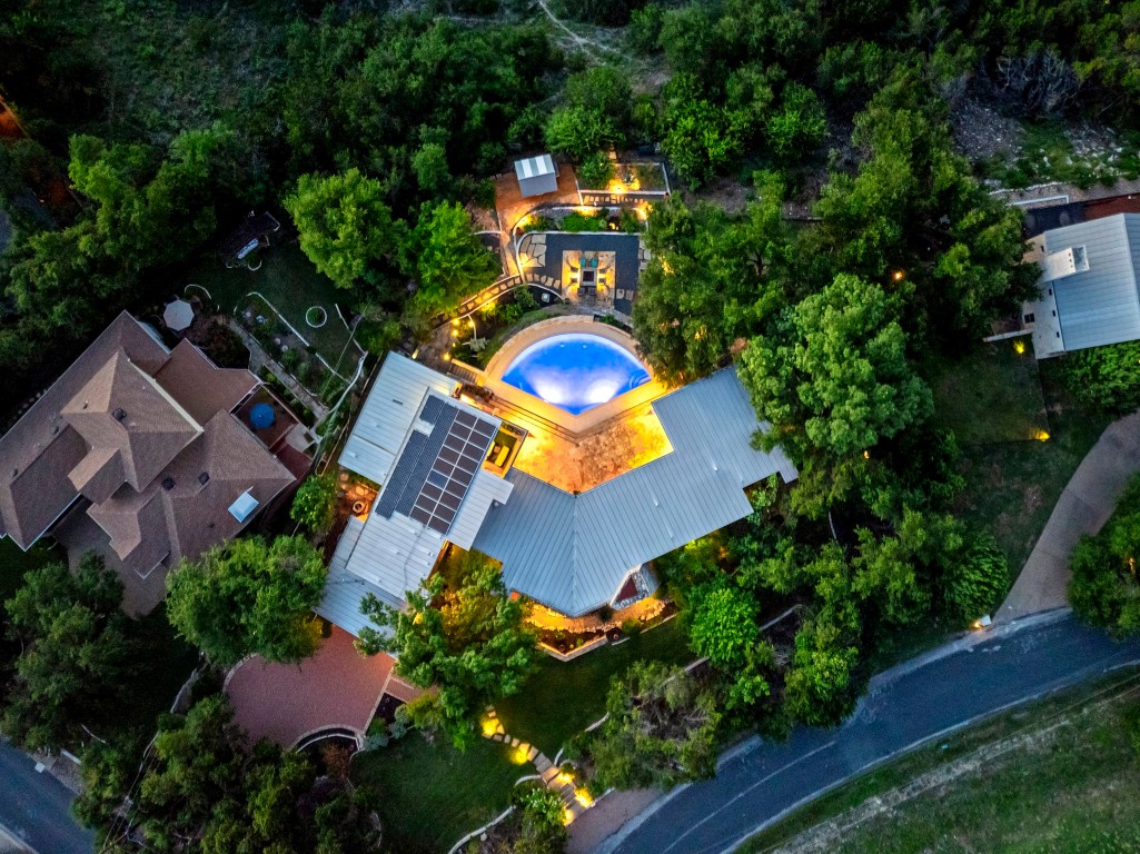 an aerial view of a house with outdoor space pool patio and outdoor seating