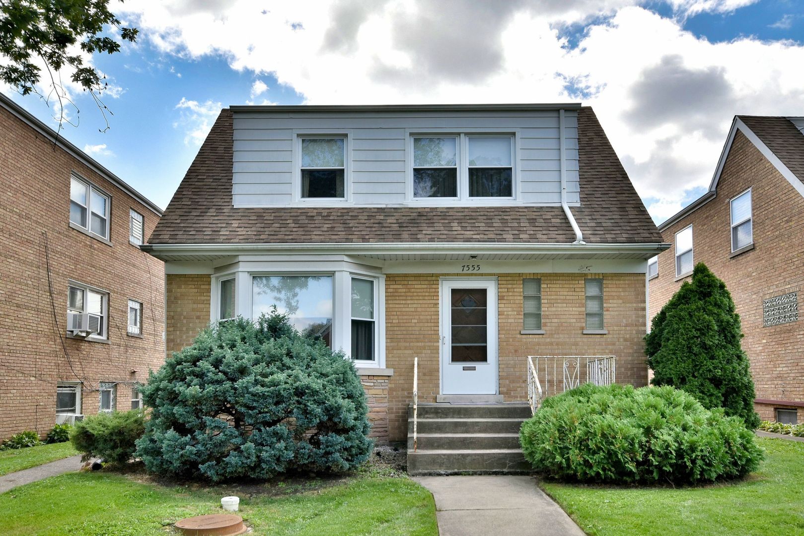 7555 Monroe Street Niles, IL 60714 - Photo 1 of 41 a front view of a house with a yard