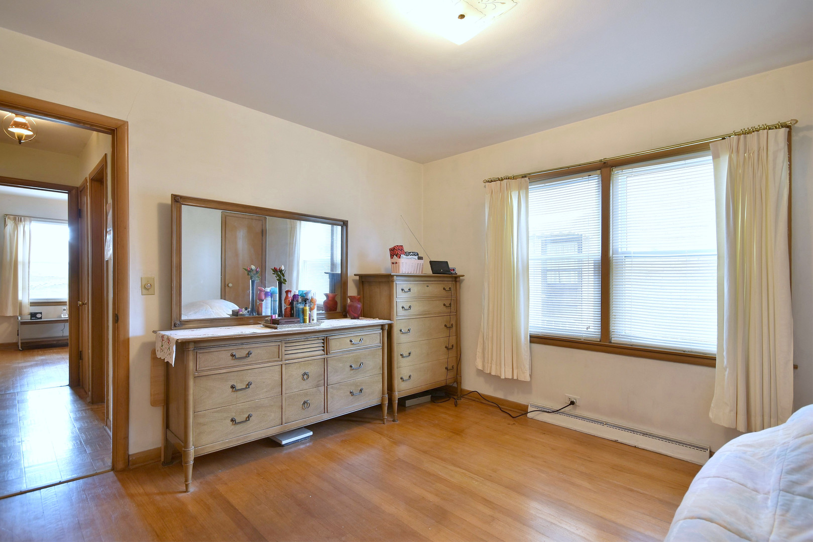 7555 Monroe Street Niles, IL 60714 - Photo 11 of 41 a view of a room with cabinet mirror and windows