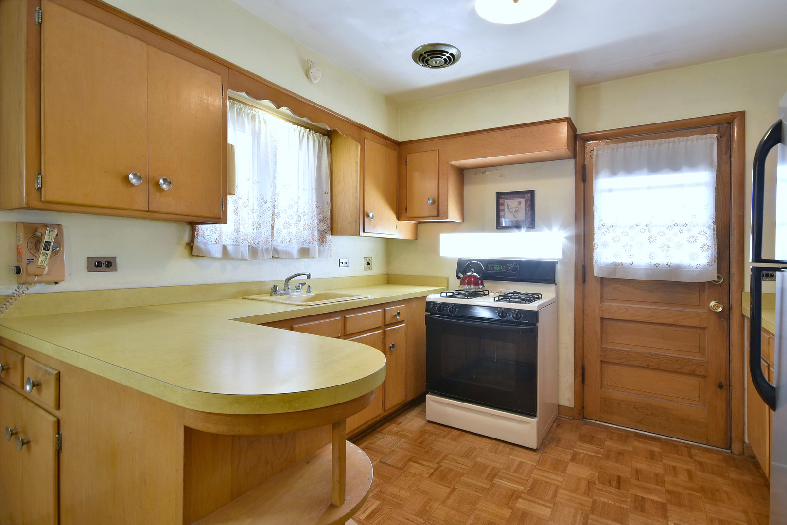 7555 Monroe Street Niles, IL 60714 - Photo 20 of 41 a kitchen with a sink appliances and cabinets