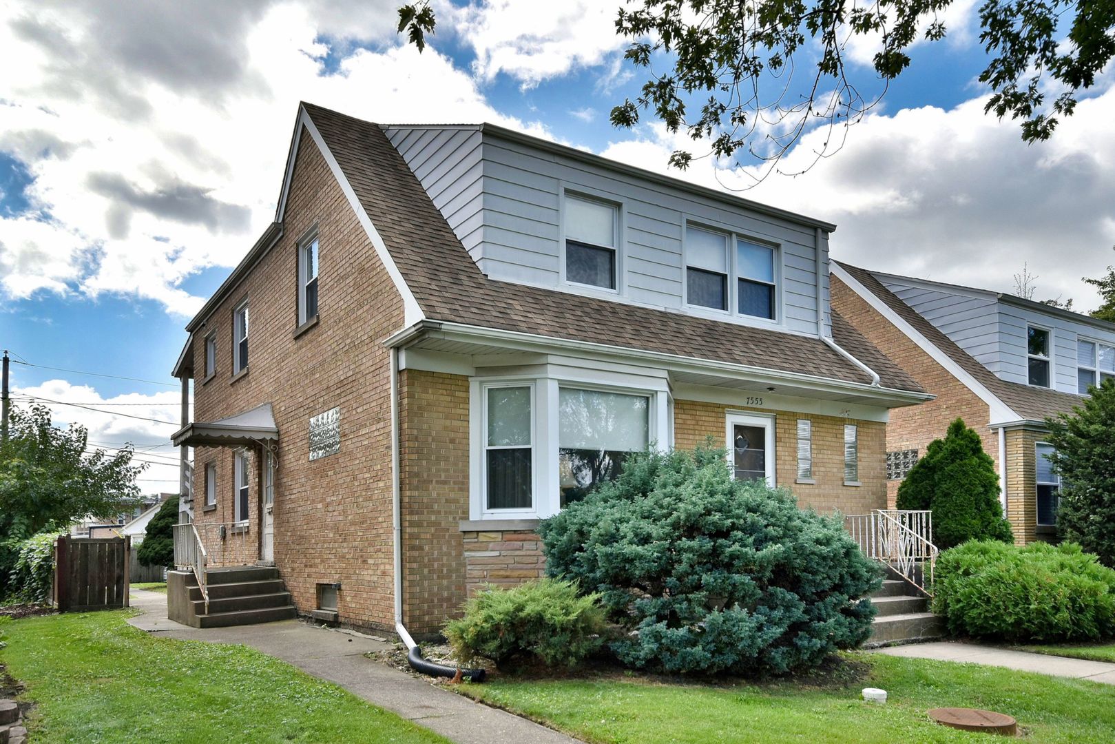 7555 Monroe Street Niles, IL 60714 - Photo 2 of 41 a front view of a house with a yard