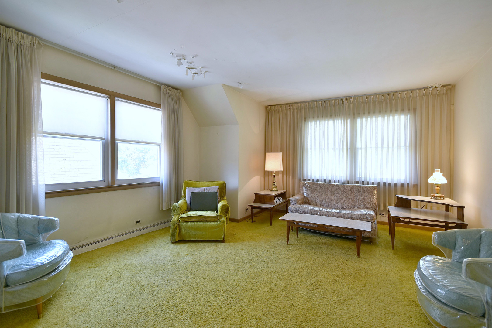 7555 Monroe Street Niles, IL 60714 - Photo 22 of 41 a living room with furniture and a window
