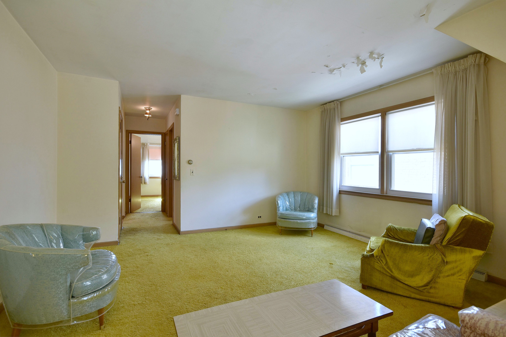 7555 Monroe Street Niles, IL 60714 - Photo 23 of 41 a living room with furniture and a window