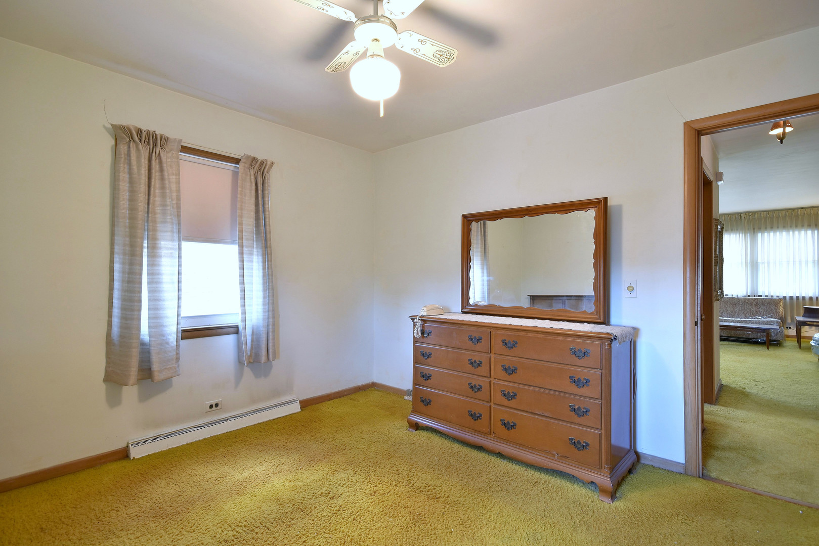 7555 Monroe Street Niles, IL 60714 - Photo 25 of 41 a room with window and a dresser