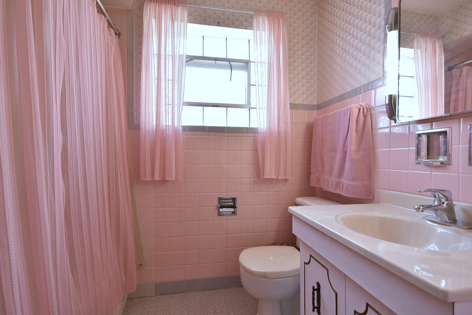 7555 Monroe Street Niles, IL 60714 - Photo 26 of 41 a bathroom with a granite countertop sink toilet and a mirror