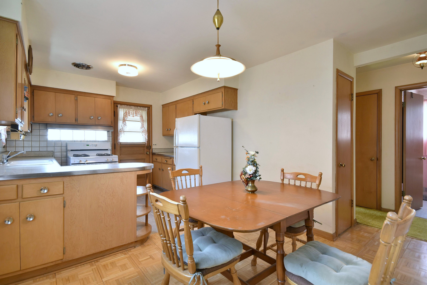 7555 Monroe Street Niles, IL 60714 - Photo 30 of 41 a view of a dining room with furniture and wooden floor