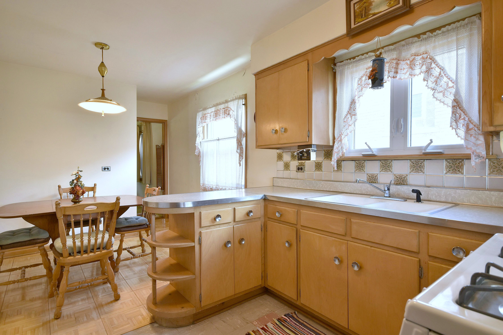 7555 Monroe Street Niles, IL 60714 - Photo 33 of 41 a kitchen with a sink cabinets and window