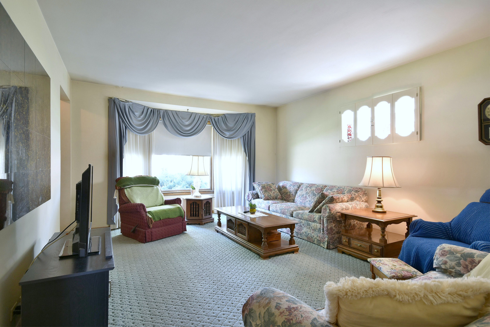 7555 Monroe Street Niles, IL 60714 - Photo 6 of 41 a bedroom with furniture and a large window