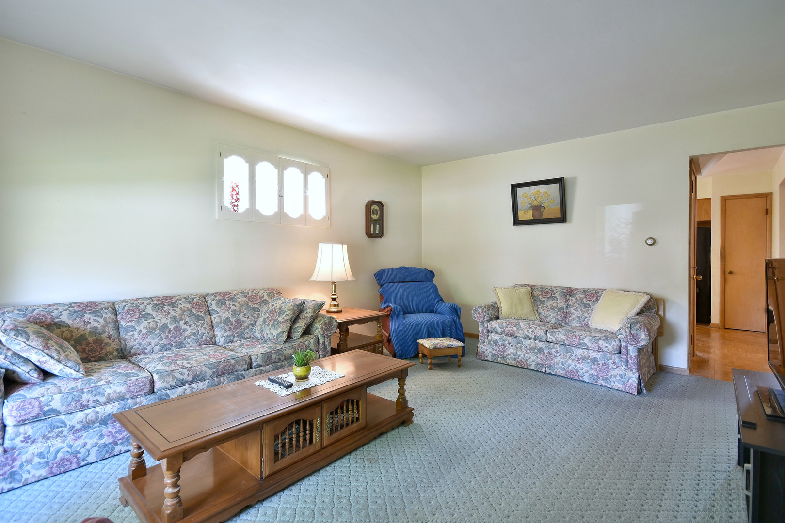 7555 Monroe Street Niles, IL 60714 - Photo 7 of 41 a living room with furniture and a couch