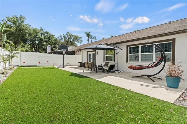 a house view with swimming pool and garden space