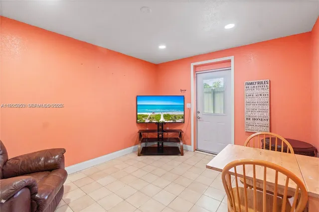 a bedroom with furniture and a chair