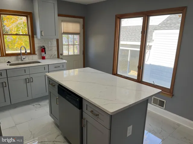 a kitchen with a stove and a sink