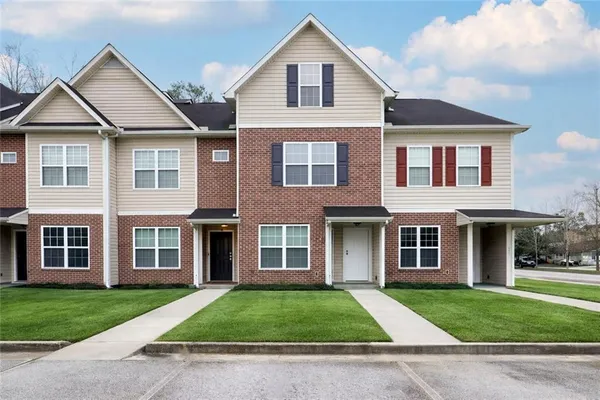 front view of a house and a yard