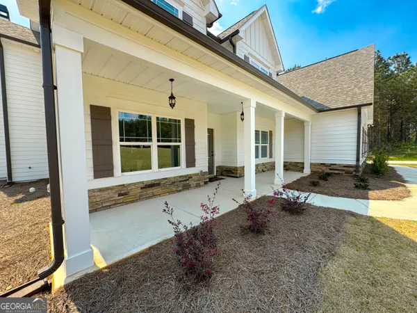 a bathroom with a shower a toilet and a shower