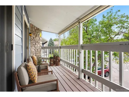 a view of balcony with furniture