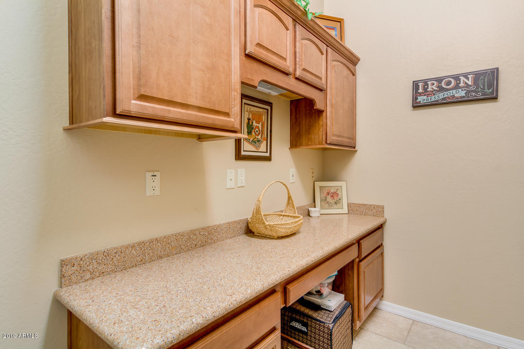 1126 West Joy Ranch Road Phoenix, AZ 85086 - Photo 36 of 45 Laundry Room with Quartz Countertops
