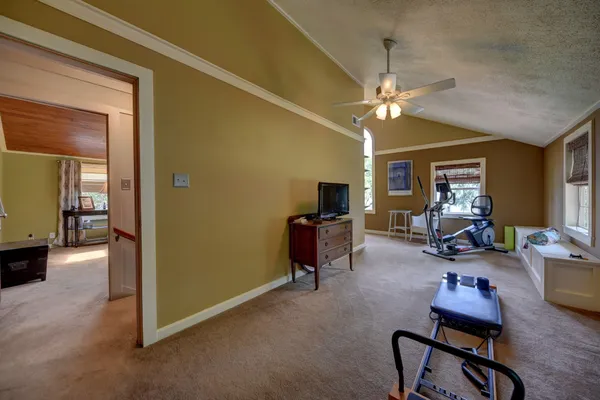 a view of a livingroom with workspace and a window