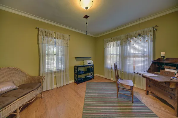 a bedroom with furniture and a window