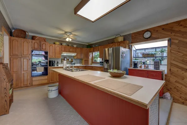a kitchen with stove and cabinets
