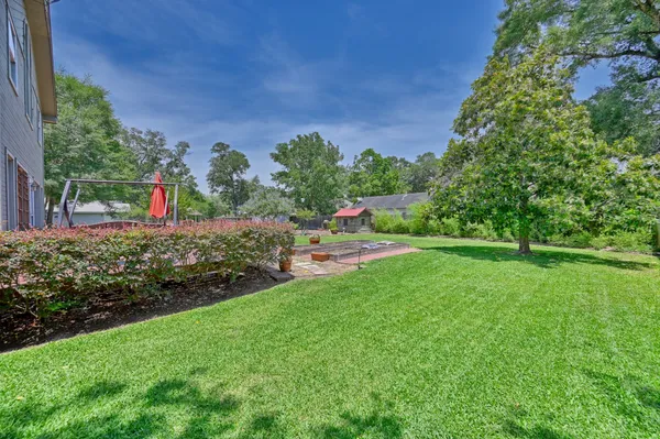 a view of a garden with houses