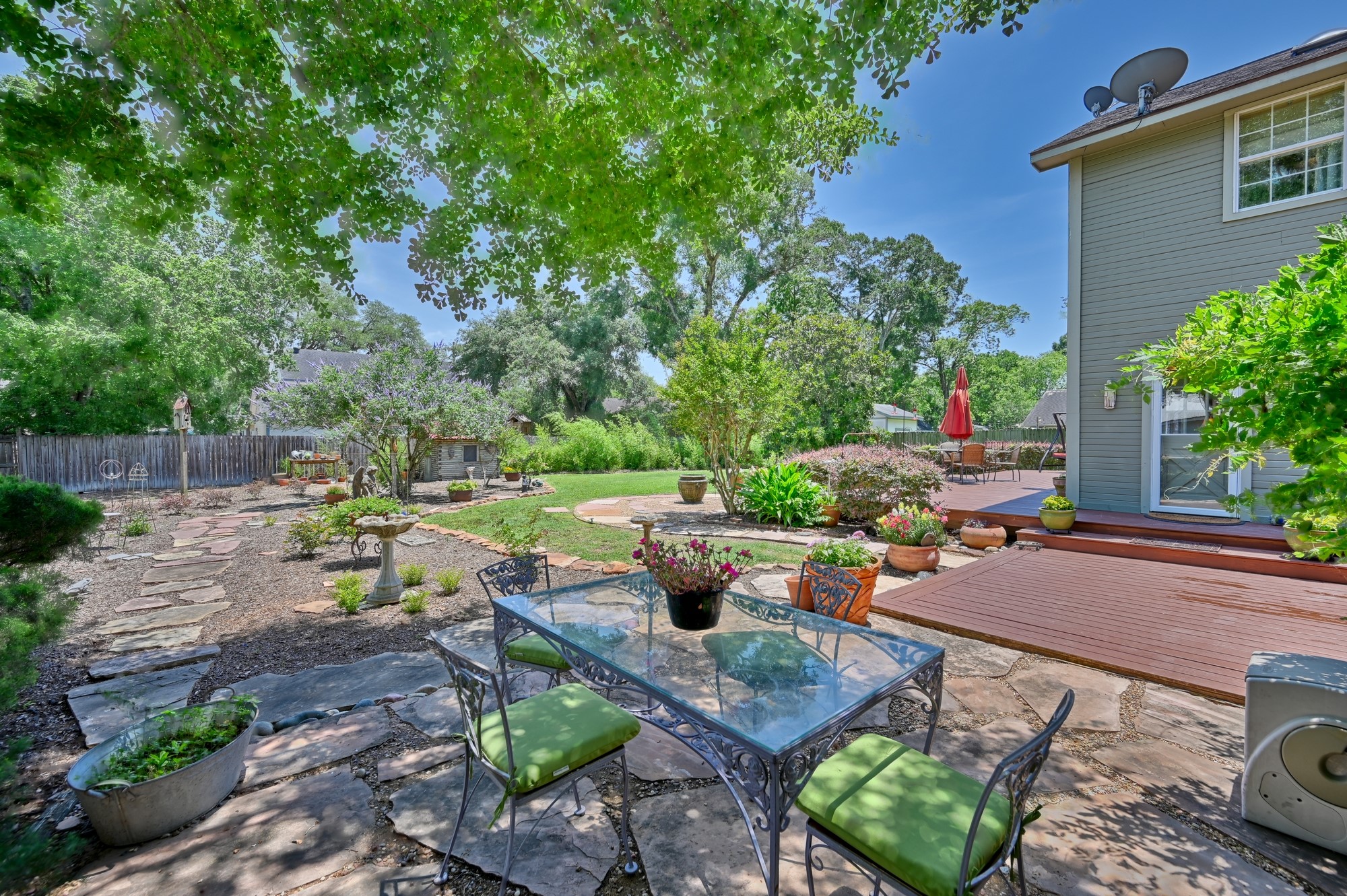 1026 Atchison Street Sealy, TX 77474 - Photo 7 of 50 a view of a backyard with sitting area and garden