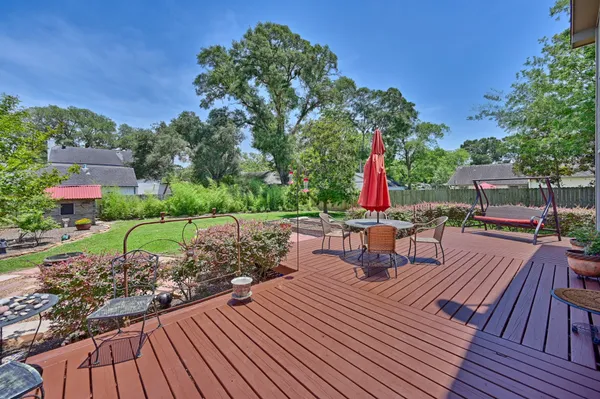 a view of a backyard with sitting area