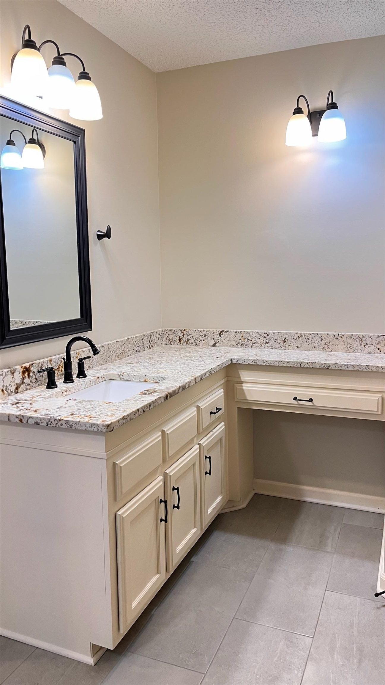 7770 Juniper Cove West Memphis, TN 38016 - Photo 24 of 34 a bathroom with a granite countertop sink and a mirror