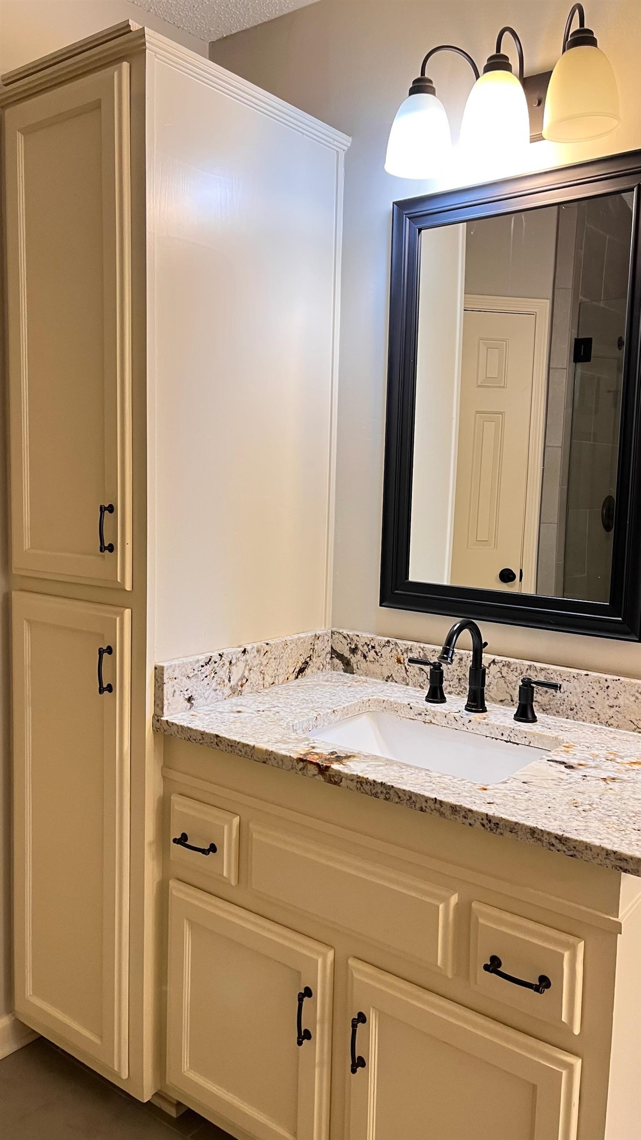 7770 Juniper Cove West Memphis, TN 38016 - Photo 25 of 34 a bathroom with a granite countertop sink and a mirror