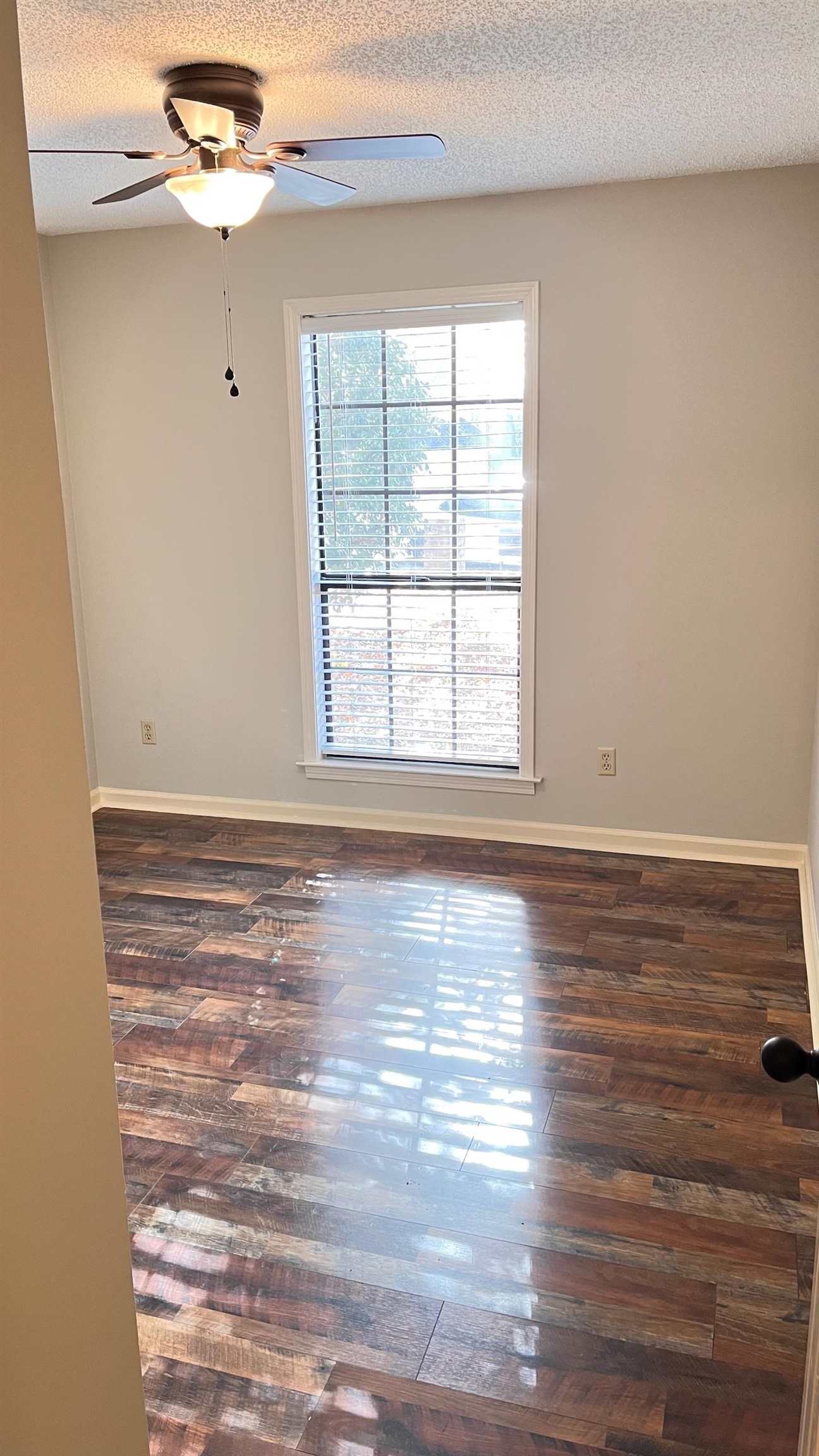 7770 Juniper Cove West Memphis, TN 38016 - Photo 30 of 34 wooden floor in an empty room with a window