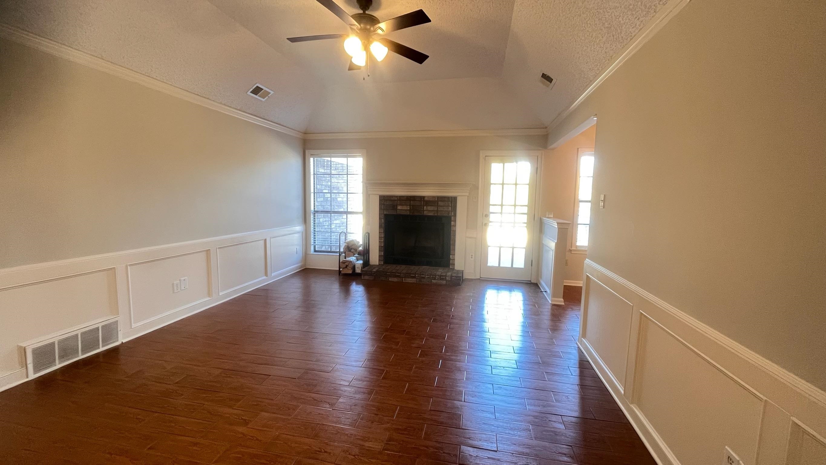 7770 Juniper Cove West Memphis, TN 38016 - Photo 9 of 34 a view of a hallway with wooden floor and a kitchen