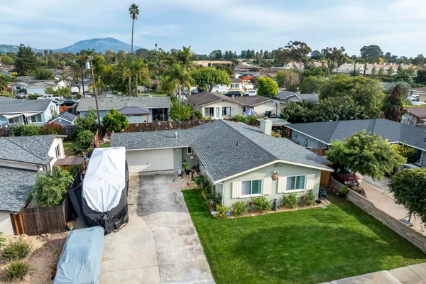 a view of multiple houses with a garden