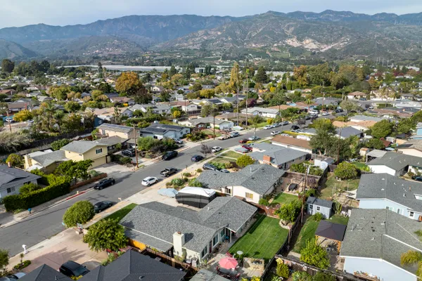 an aerial view of residential houses with outdoor space