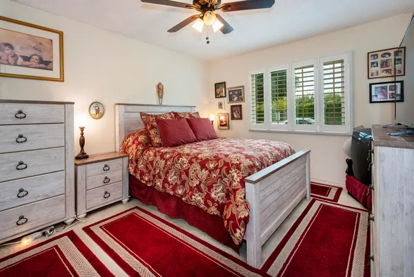 a bed room with a bed and a window