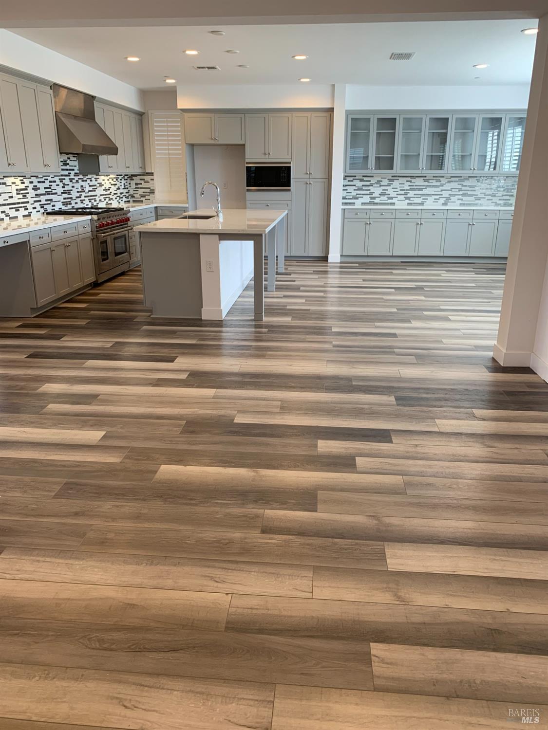 2522 Barley Lane Santa Rosa, CA 95403 - Photo 4 of 13 a view of a kitchen with kitchen island a sink stainless steel appliances and a counter top space