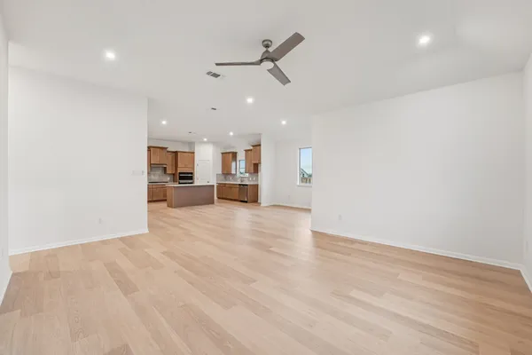 a view of a kitchen with a sink and a window