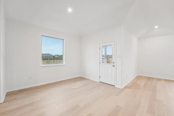 an empty room with a empty space and windows