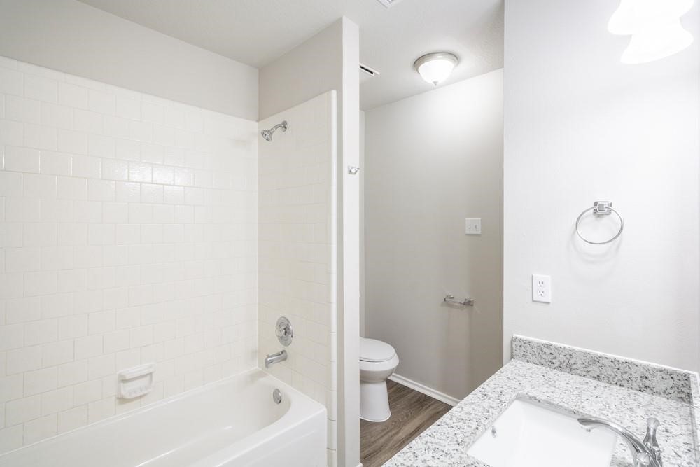 2007 Ruffian Lane Stafford, TX 77477 - Photo 13 of 17 a bathroom with a bathtub and a toilet