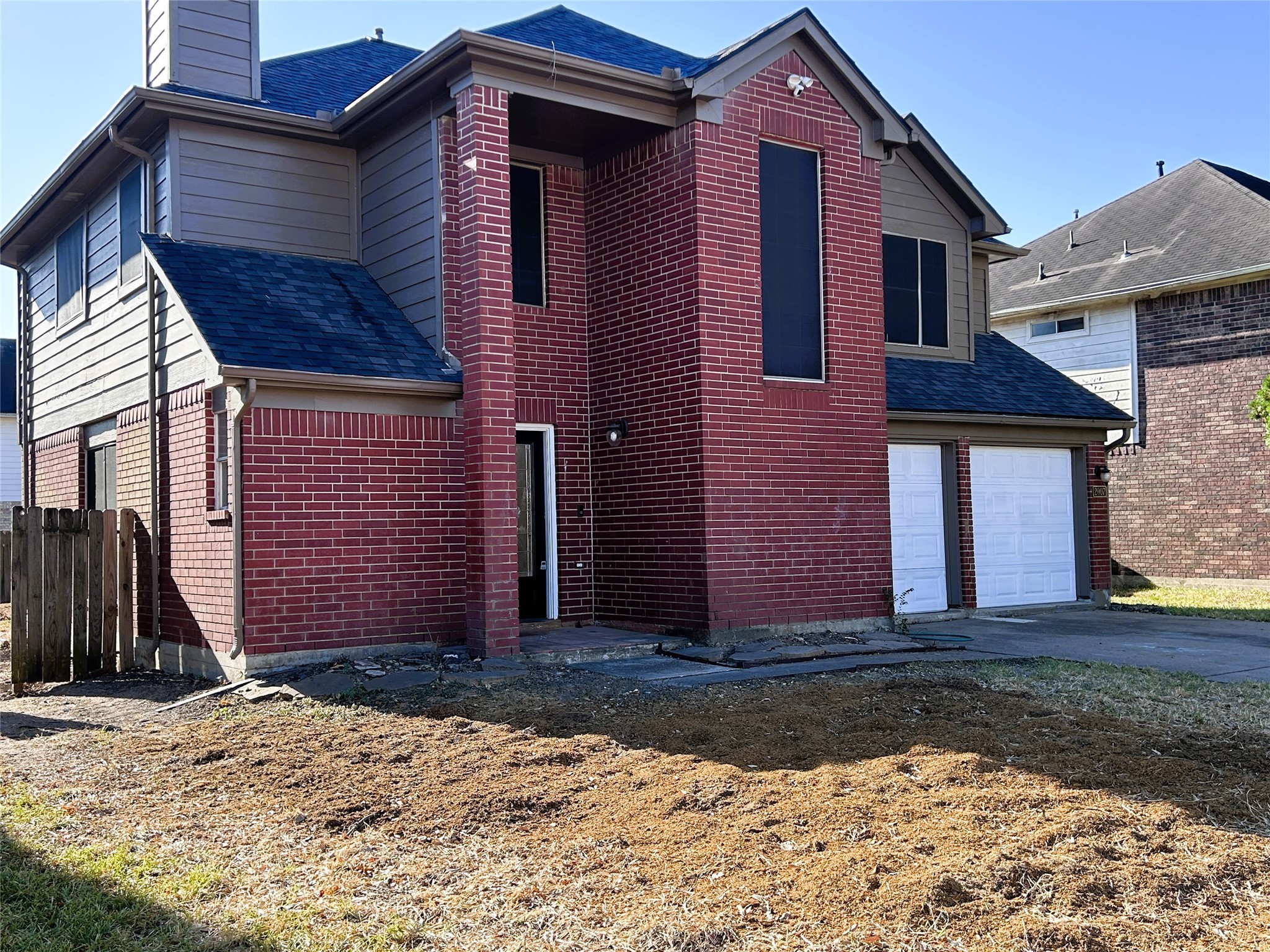 2007 Ruffian Lane Stafford, TX 77477 - Photo 2 of 17 a front view of a house with a yard