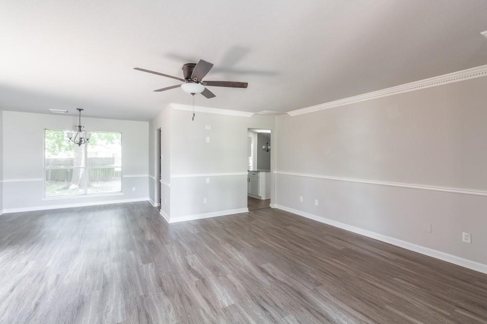 2007 Ruffian Lane Stafford, TX 77477 - Photo 3 of 17 wooden floor in an empty room with a window