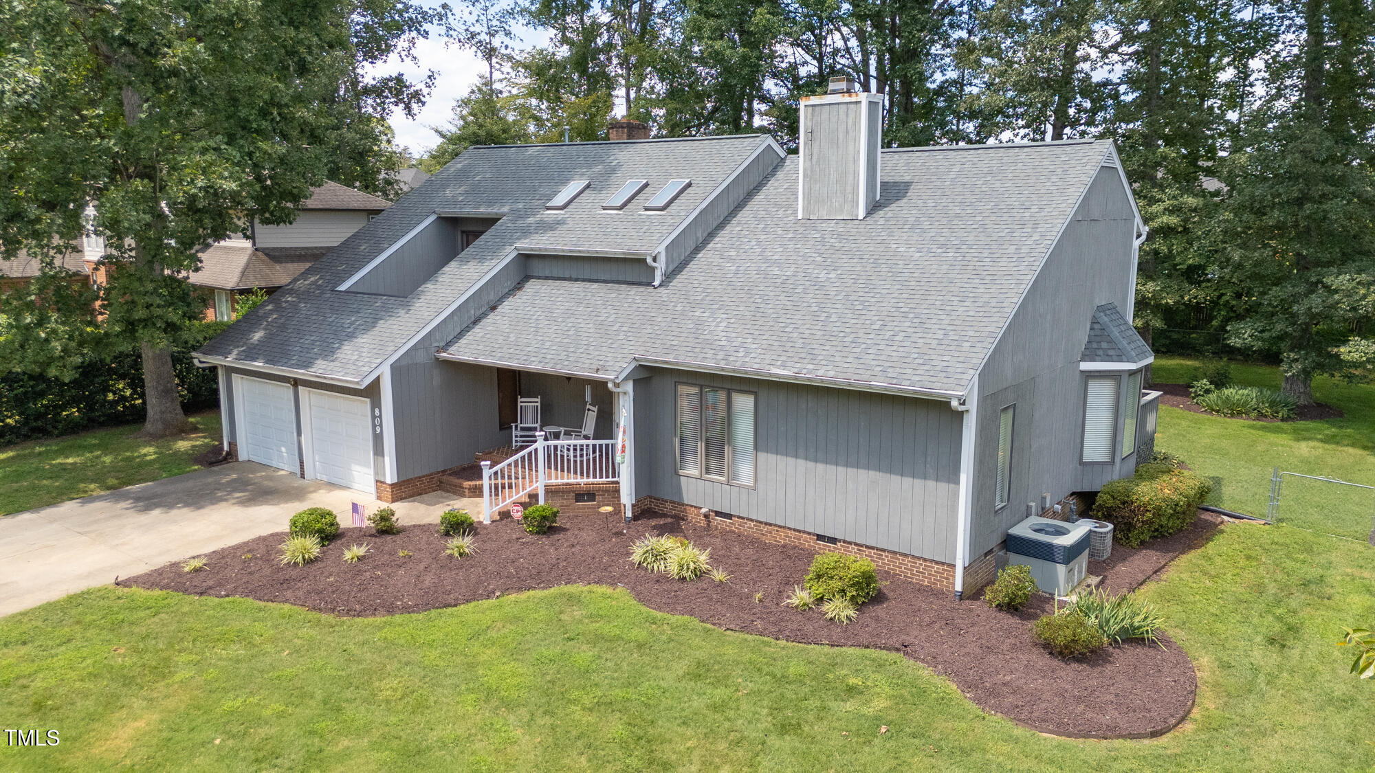 809 Brookview Drive Elon, NC 27244 - Photo 44 of 53 a view of a house with a yard patio and fire pit