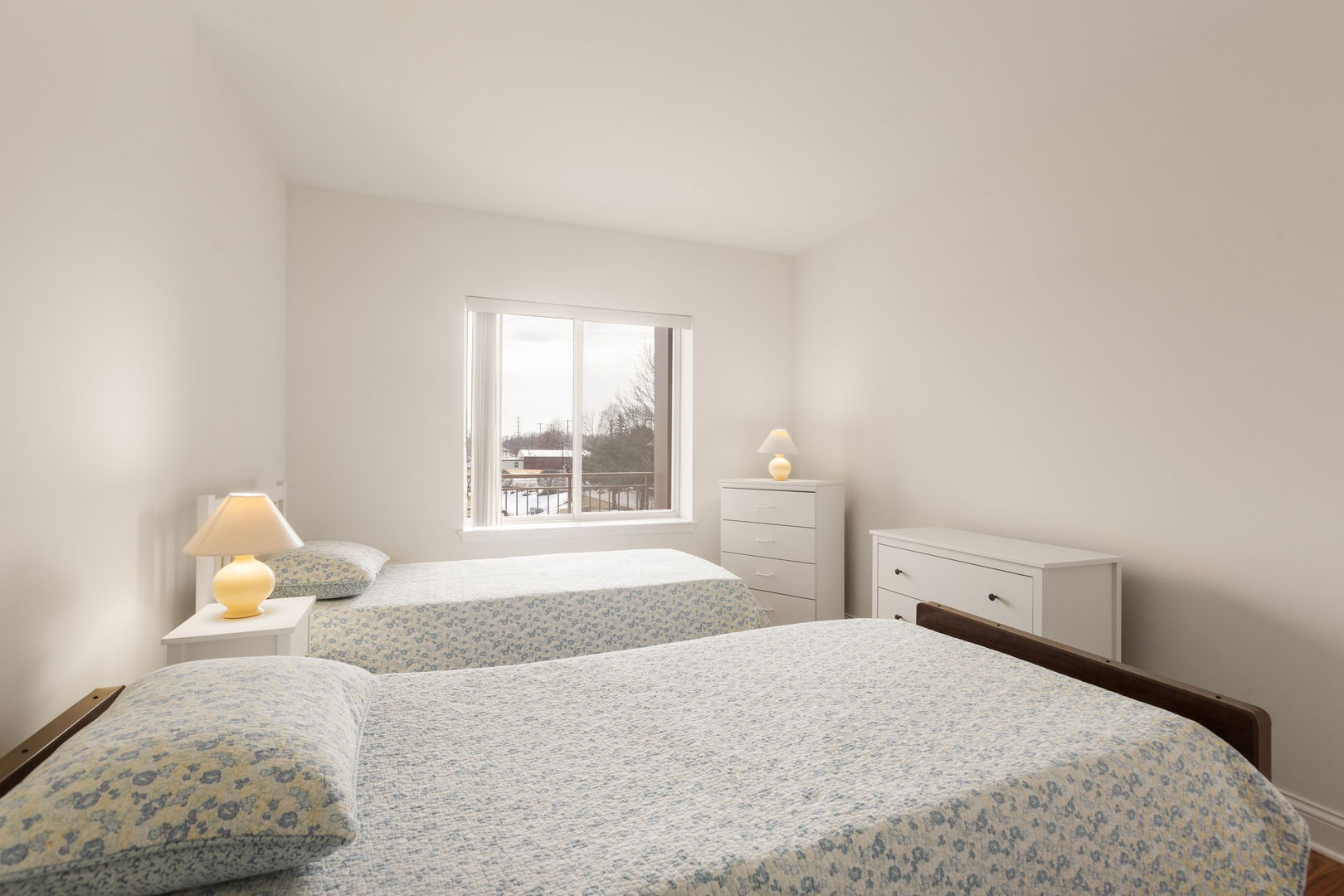 125 North Buffalo Grove Road, Unit 104 Buffalo Grove, IL 60089 - Photo 12 of 17 a bedroom with a bed and window