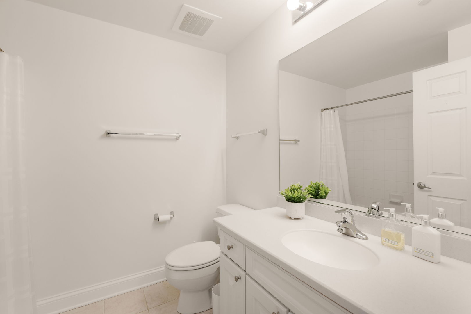 125 North Buffalo Grove Road, Unit 104 Buffalo Grove, IL 60089 - Photo 13 of 17 a bathroom with a sink and a mirror