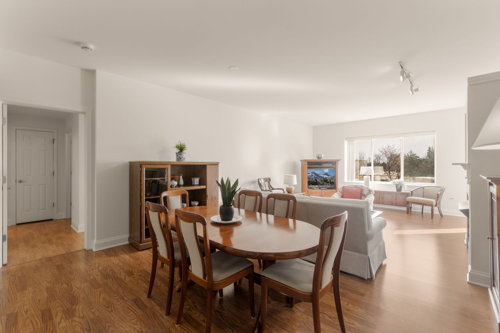 125 North Buffalo Grove Road, Unit 104 Buffalo Grove, IL 60089 - Photo 7 of 17 a view of a dining room with furniture and wooden floor